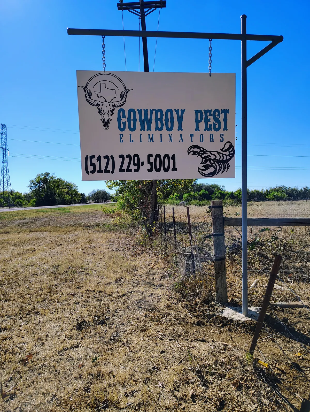 Cowboy Pest Eliminators roadside sign